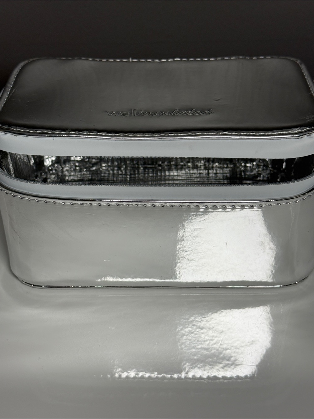 Well insulated Silver Patent Cosmetic Case 6.25, Used once